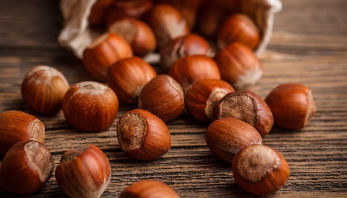 Close up of hazelnuts on the wooden texture